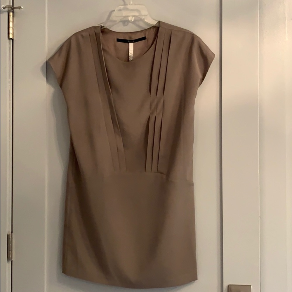 Modern style mini dress with pleating detail.!